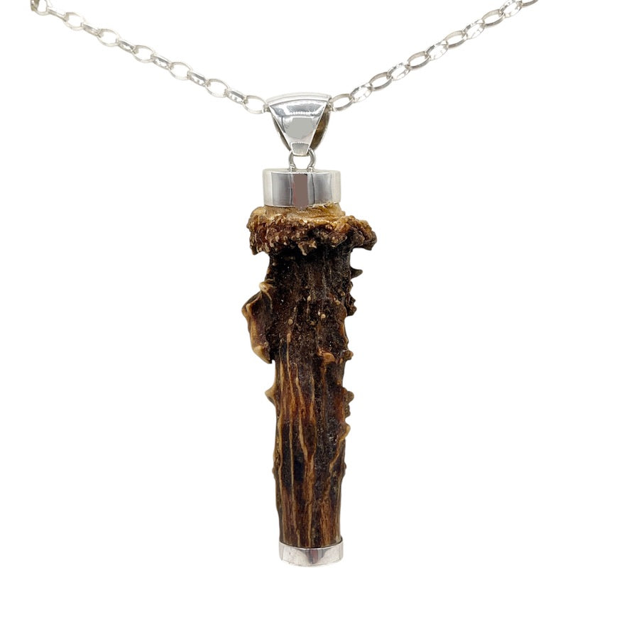One-of-a-kind natural deer antler pendant with 925 sterling silver fittings, front angled view