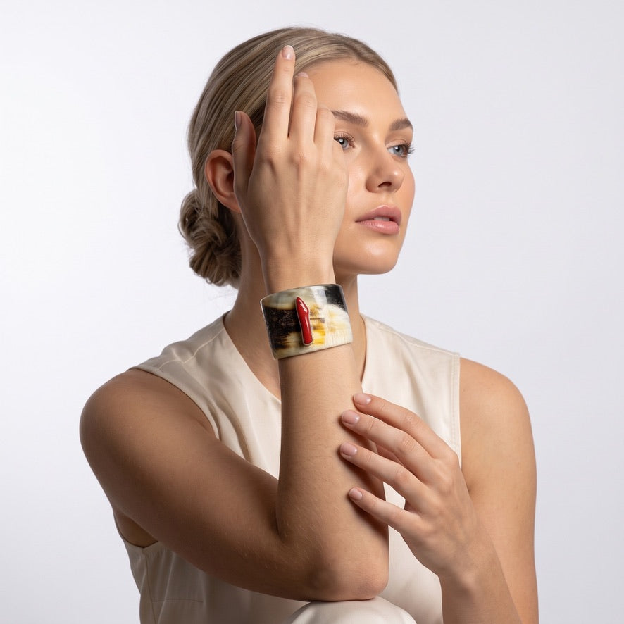 Buffalo horn and red branch coral cuff bracelet worn on wrist, JOYAVELLE statement jewellery