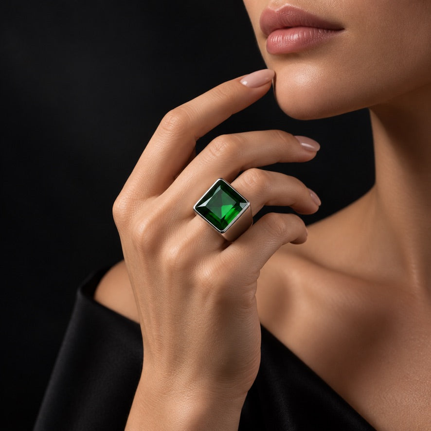 Woman wearing adjustable emerald green square volcanic glass statement ring in 925 sterling silver
