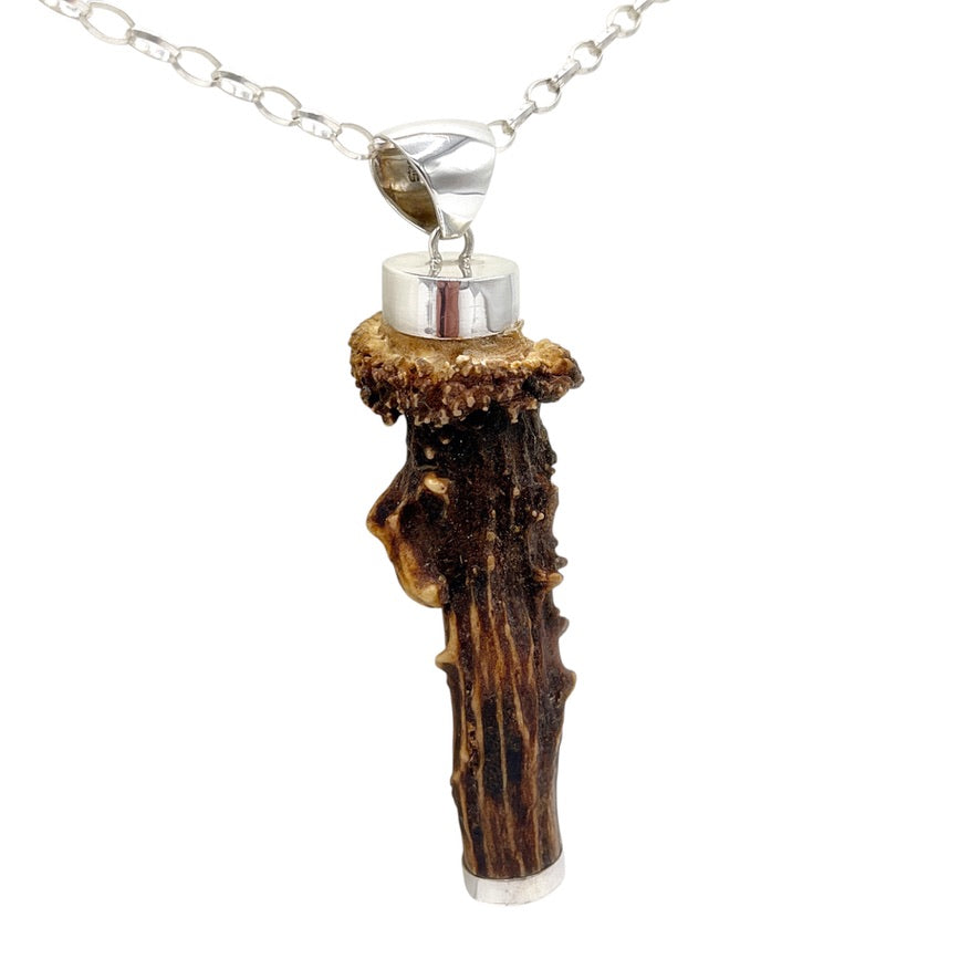 atural deer antler statement pendant with 925 sterling silver details, angled view