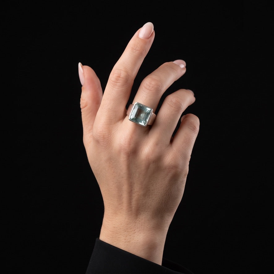 Sea blue volcanic glass square statement ring in 925 sterling silver worn on hand